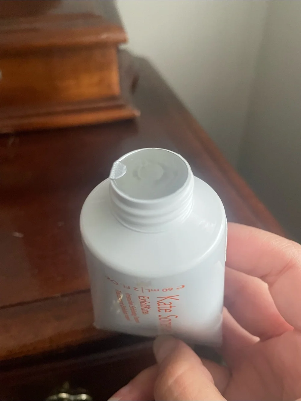 HUE White Tube Facial Cleanser & Exfoliant with Orange Text